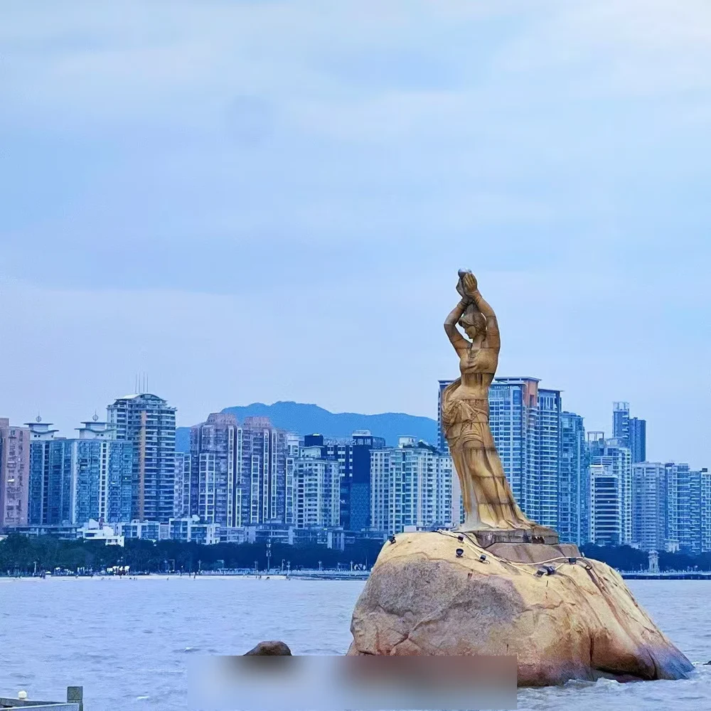 Her evidence: the Zhuhai Fisher Girl statue, grey sky in the original — and radiant blue after the filters